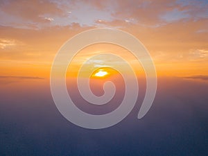 Flying above the clouds during sunset