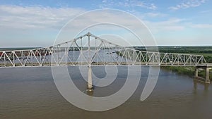 Flying Above the Mississippi River and Veterans Memorial Bridge in New Orleans. Gramercy Alumina Refinery Factory in Background