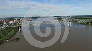 Flying Above the Mississippi River and Veterans Memorial Bridge in New Orleans. Gramercy Alumina Refinery Factory in Background