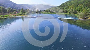 Flying above national park of Una river and its clear waterfalls, Bosnia