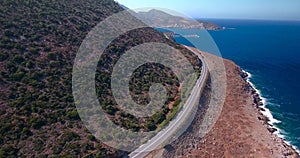 Flying above road by seashore