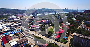Flying above Vladivostok residential district. Aerial view of Mine Park. Russia