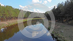 Flying above the water channel in the forest