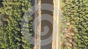 Flying above the water channel in the forest