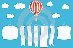 Flying advertising banner. Hot air balloon with vertical banners on blue sky background.