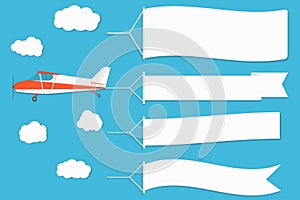 Flying advertising banner. Plane with horizontal banners on blue sky background.