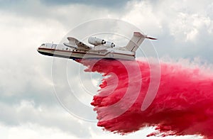 Flying aerial firefighting pour water photo
