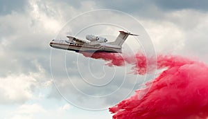 Flying aerial firefighting pour water photo