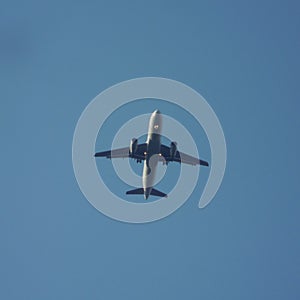 Flying aeroplane in clear sky