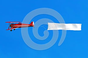 Flying airplane and banner on blue sky. 3D illustration