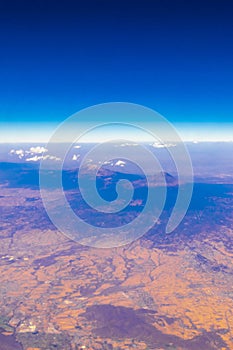 Flying airplane over Mexico Clouds Sky Volcanoes Mountains City desert