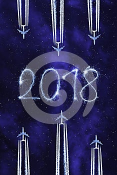 Flying airplanes on the night sky. New Year 2018 concept.