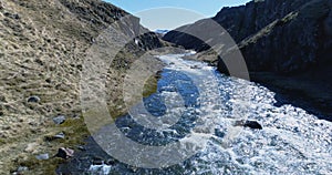 Flying along river valley in north Iceland