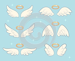 Flying angel wings with gold nimbus. Angelic wing cartoon vector set