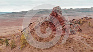 Flying around the cliff sightseeing. Red sandstone protrudes from the mountain