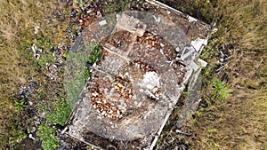 Flying around a completely burnt building with a surviving red brick oven.