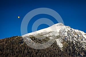 Flying balloon over the snowy mountain Solisko in the High Tatra