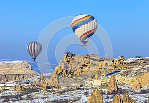 Flying balloons over mountains at sunset. Capadocia. Turkey.