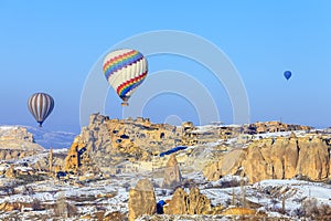 Flying balloons over mountains at sunset. Capadocia. Turkey.