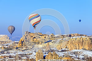 Flying balloons over mountains at sunset. Capadocia. Turkey. photo