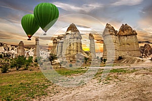 Flying balloons in rock landscape, Cappadocia, Turkey