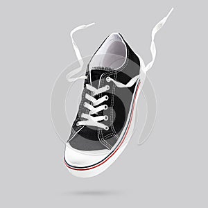 Flying black sneakers isolated on gray background. Fashionable stylish sports casual shoes. Creative minimalistic layout with