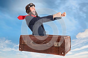 Flying businessman in a suitcase