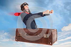 Flying businessman in a suitcase