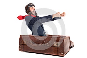 Flying businessman in a suitcase