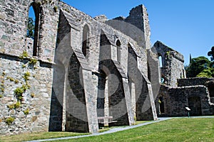 Flying buttresses on the side of a ruined abbey