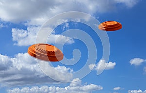Flying clay disc target shooting on the blue sky , Clay pigeon targets game photo