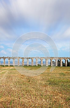 Flying clouds over aqueduct