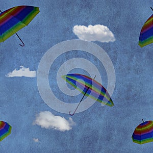 Flying colorful umbrellas on blue sky