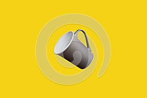 Flying Concept of Brown Coffee Tea Cup on Yellow Background