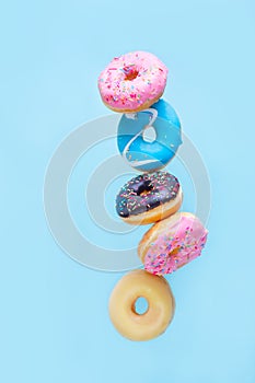 Flying doughnuts on blue