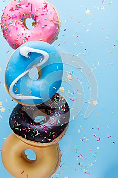 Flying doughnuts on blue