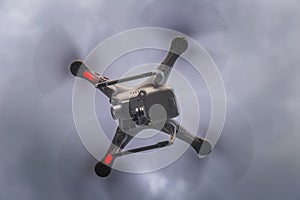 Flying drone against sky