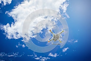 flying drone with camera on the blue sky