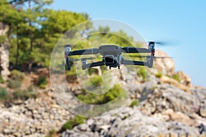 Flying drone on mountain background