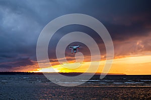 Flying drone over sea and cloud sky