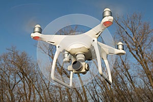 Flying drone quadcopter Dji Phantom 4 with high resolution digital camera.