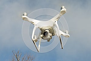 Flying drone quadcopter Dji Phantom 4 with high resolution digital camera.