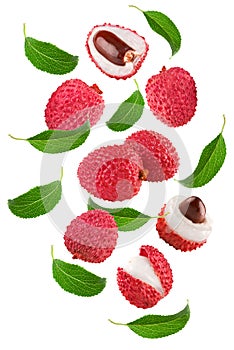 Flying fresh lychee with slices and green leaves isolated on white background. clipping path