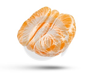 Flying fruits. Half a tangerine on a white isolated background. A mandarin orange without a peel casts a shadow in close