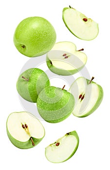 flying green apples isolated on white background. clipping path