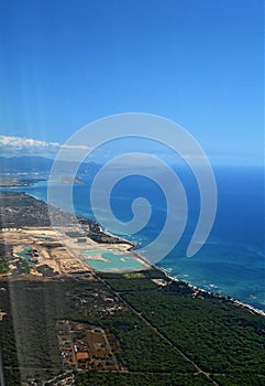 Flying into Hawaii with the ocean view and blue sky and coastline