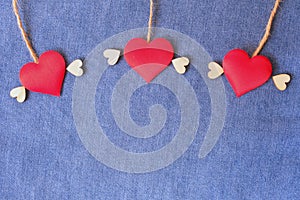 Flying heart on blue jean background. Delivering love frame. Backdrop for Valentine's concept