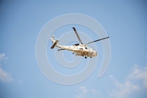 Flying helicopter against blue sky displaying modern rescue capabilities