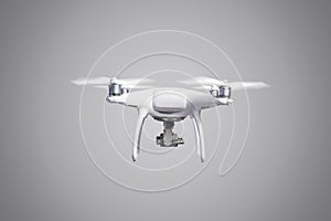 Flying helicopter drone with camera. Studio shot.