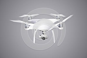 Flying helicopter drone with camera. Studio shot.